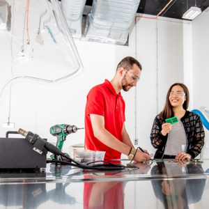 man and woman working in a workshop